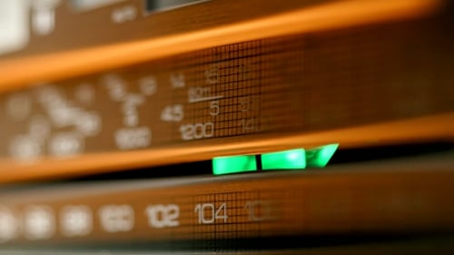 Old Vintage Radio Being Tuned By Turning Dial. Shot