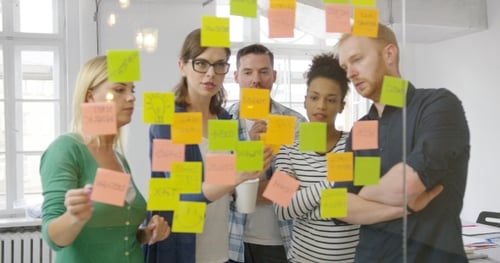 Brainstorming Session with Sticky Notes in Office