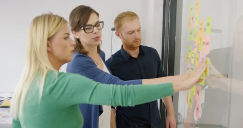 Business Team Collaborates on Ideas with Sticky Notes