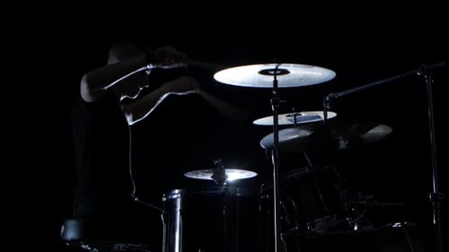 Good Music in the Performance of a Professional Drummer on Black Background