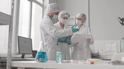 Medical Professionals Collaborating in Modern Laboratory