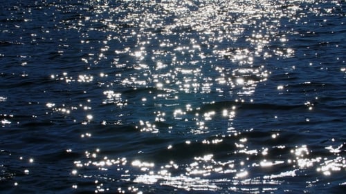 The Glare From the Sun on the Waves.
