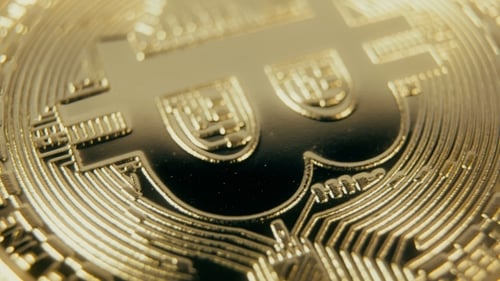 Extreme Close Up of Gold Bitcoin Currency