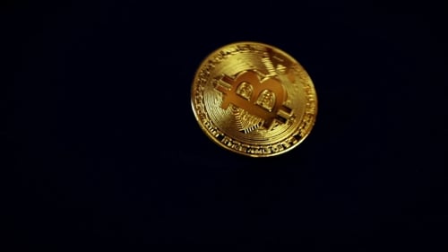 Crypto Currency Gold Bitcoin - BTC - Bit Coin. Bitcoin Rotation Over Black.