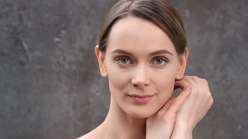 Young Fresh European Woman with Bare Body Touching Chin Smiling Posing at Dark Studio Shot on RED