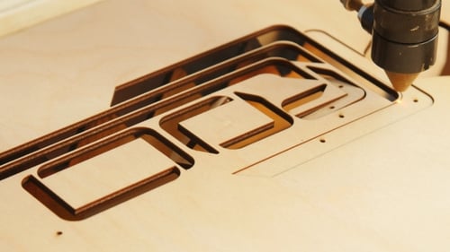 Laser Cutter Precisely Cutting Complex Wood Pattern