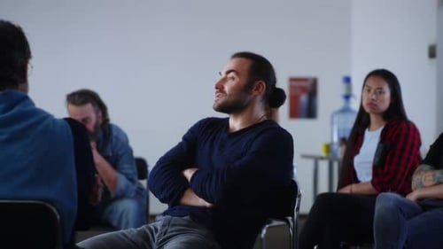 Adults Participating in a Group Meeting Indoors