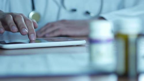 Typing On Tablet Pc And Pills in Hospital
