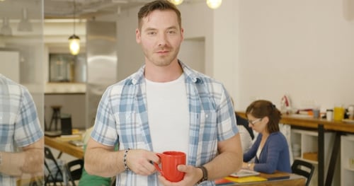 Man with Coffee in Office