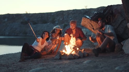 Friends Near Fireplace on the Coast