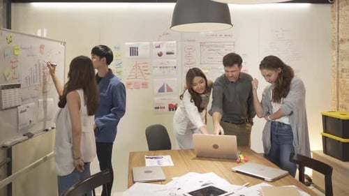 A group of multi ethnic business team talk, communicate, discuss, and work in meeting room office