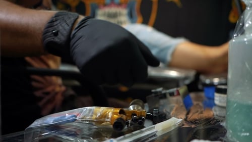 Tattoo Artist Preparing Tools in Tattoo Studio