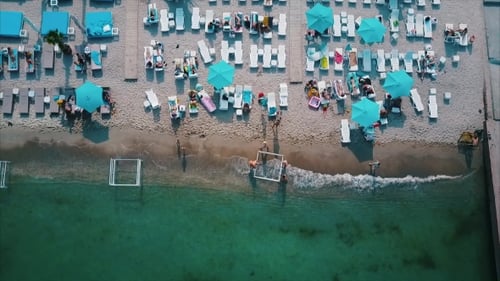 Aerial View of the Beach with Chaise-lounges