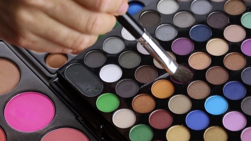 Makeup Brush Applying Eyeshadow To Palette Close Up