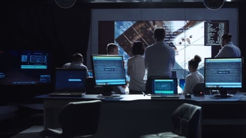 People Working in Mission Control Center