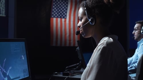 Woman at Computer in Flight Control Center