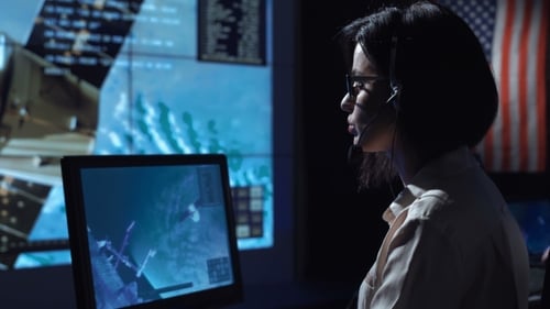 Woman at Computer in Flight Control Center