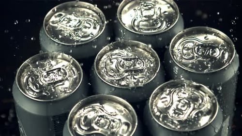 Super Slow Motion on Tin Cans with Beer Drops Water