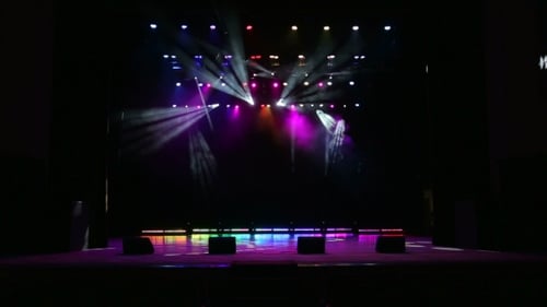 Illuminated Empty Stage with Colorful Lighting