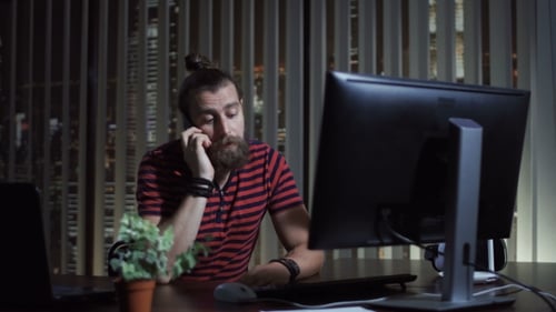 Man Calling Phone in Office