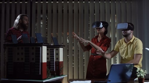 People with VR Helmets in Office