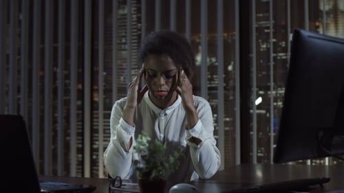 Thoughtful Woman in Office