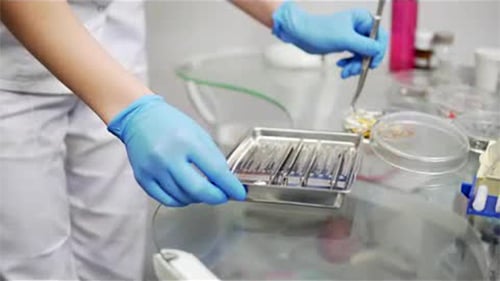 Dental Tools Sorted on Glass Medical Table