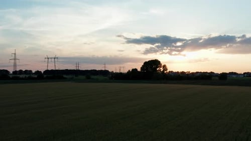 Wheat Field Aerial at Sunset with Power Lines