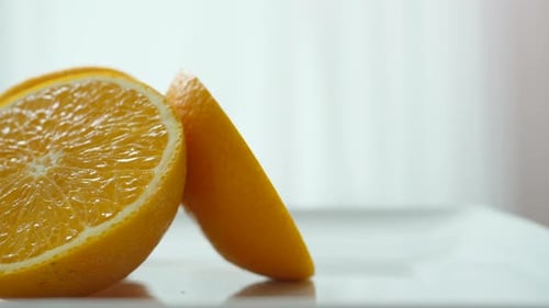 Orange fruit slice in slow motion