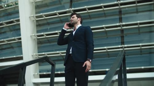 Closeup Businessman Talking Phone Outside. Businessman Checking Time on Watch