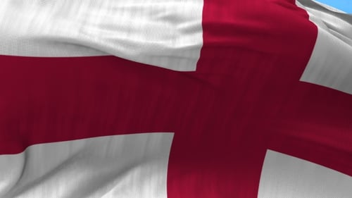 England Flag Waving Majestically in Blue Sky