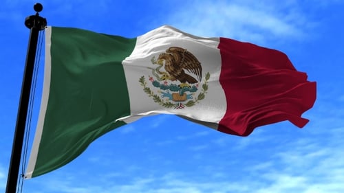 Mexico Flag Waving Against Blue Sky
