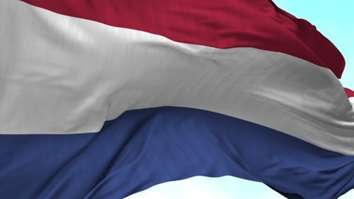Realistic Netherlands Flag Waving Against Blue Sky