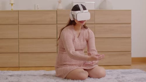 Woman Wearing VR Headset Interacting in Virtual World