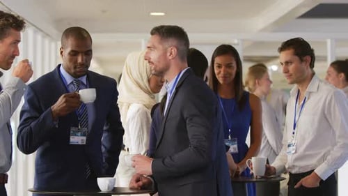 Businesspeople Chatting and Drinking Coffee Together