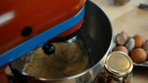 View of Female Hands Turns on the Mixer Young Woman Cooking the Dough in the Bown on the Kitchen
