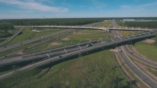 Top View at Curves and Lines of City Highway. Car Drive on Road.