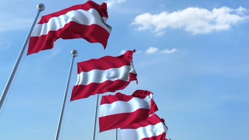 Waving Austrian Flags Animation Against Blue Sky