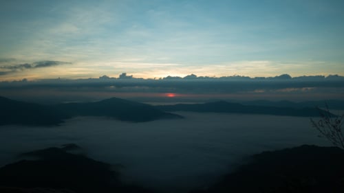 Sunrise over Mountainous Landscape with Cloudscape