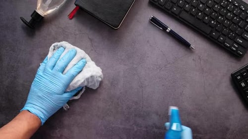 Desk is Cleaned with Disinfectant Spray and Wipe