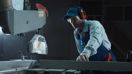 The Joiner Works on a Sawing Machine