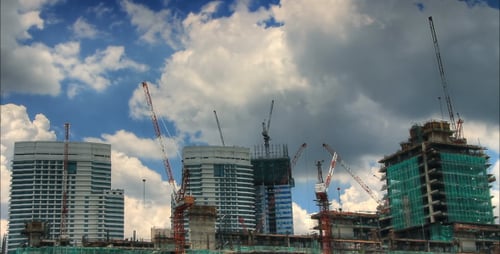 Buildings Under Construction Against a Blue Sky