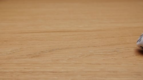 Dice Rolling on a Wooden Surface