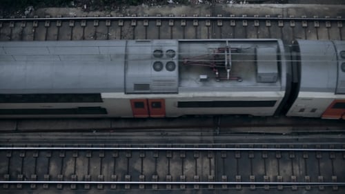 Modern Train Gliding on Tracks, Aerial View