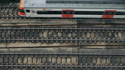 Aerial View of Train Traveling on Railroad Tracks