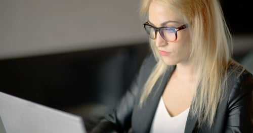 Angry Young Woman Working Until Late Evening in Office