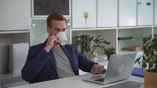 Young Businessman Working on Computer in the Office.