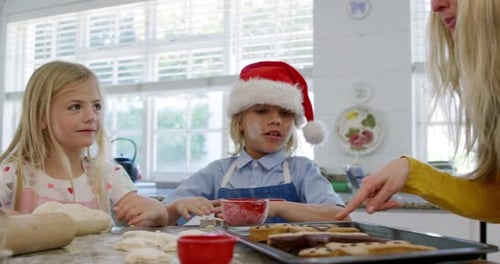 Family Baking Christmas Cookies Together at Home