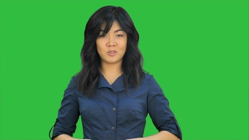 Beautiful Young Asian Woman Doing a Presentation on a Green Screen, Chroma Key