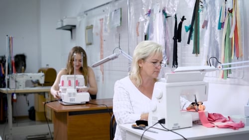 Women Sewing in Fashion Design Studio Workshop